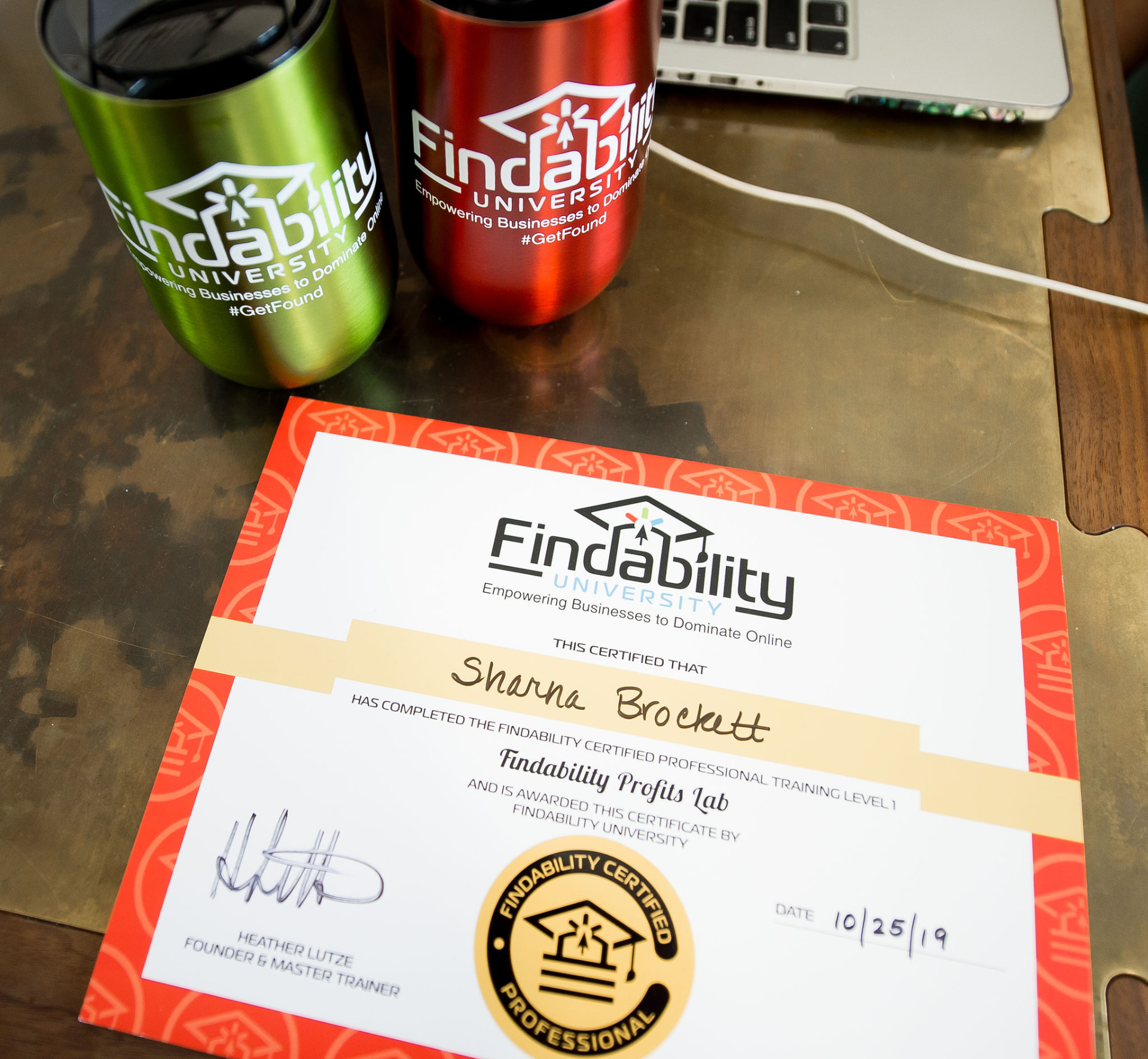 A Findability University certificate with branded workshop materials