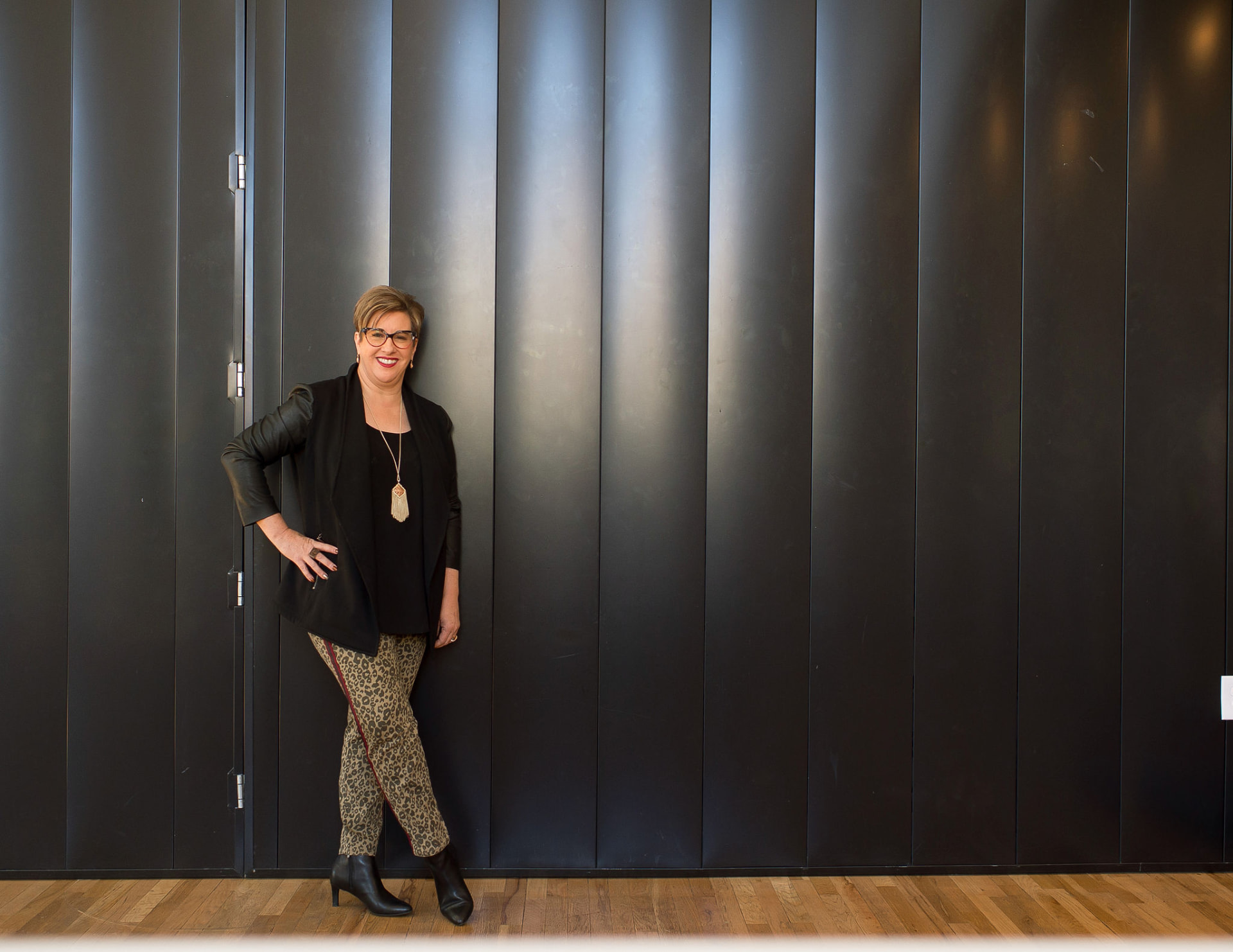 Heather Lutze standing confidently in a professional training venue