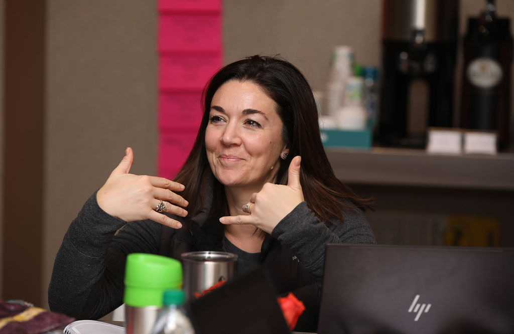 A participant explaining her plan to the room