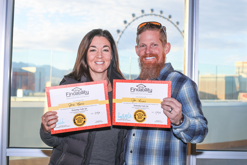 A workshop attendee holding their Findability University certificate